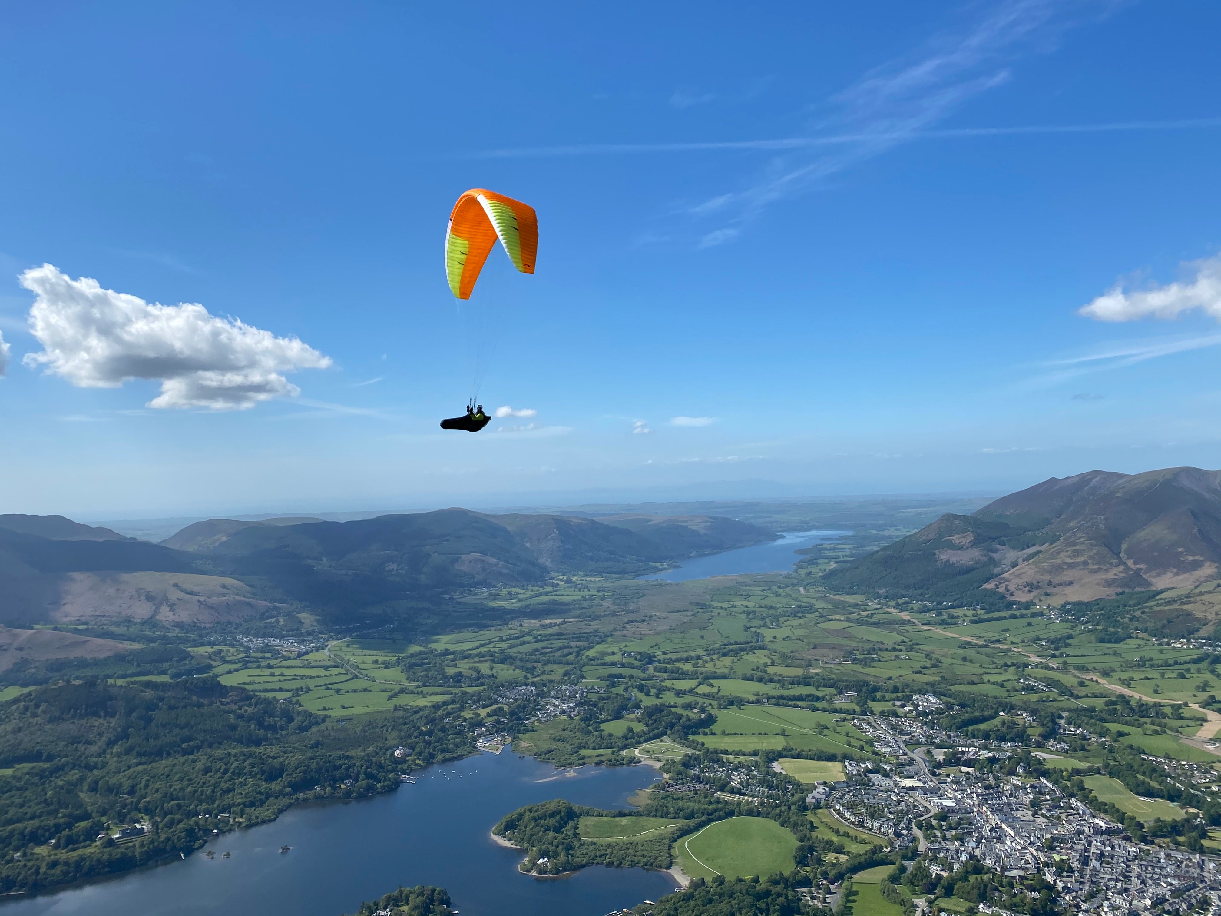 Paraglider thermalling over the Lake District
